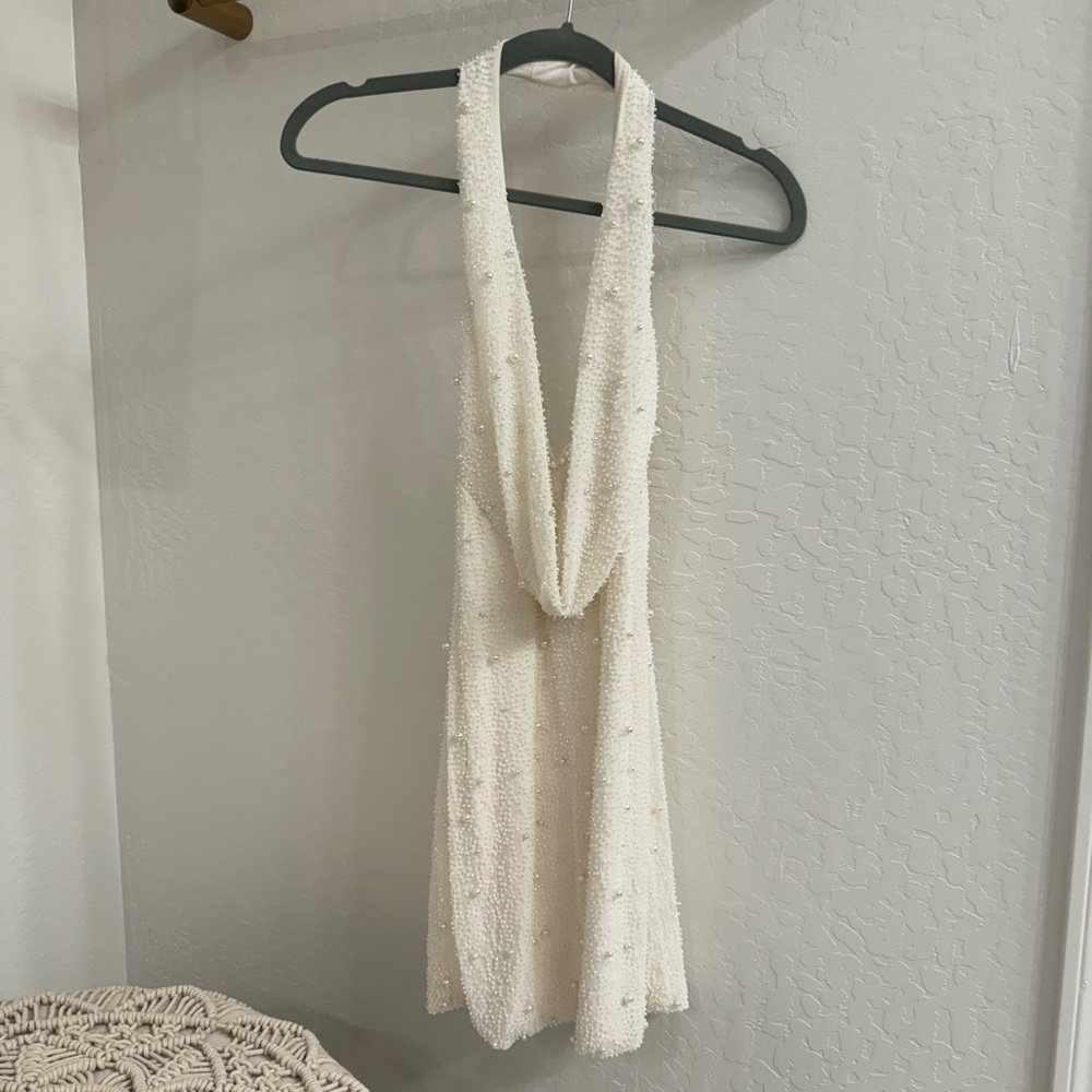 Oh Polly brand.. white beaded mini dress, low neckline, open back. US size 2.